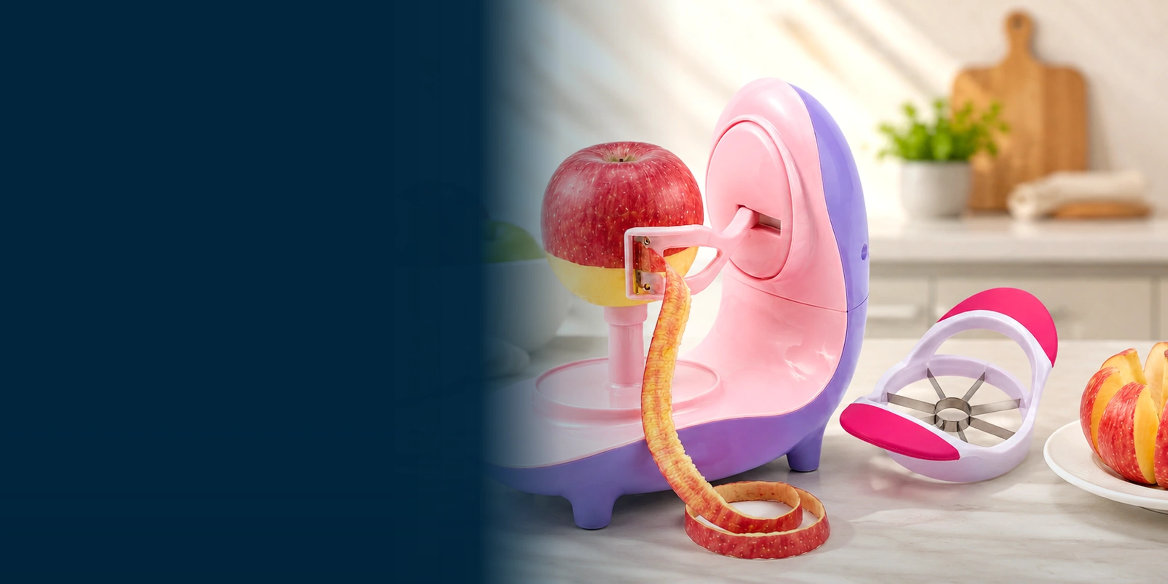 Pink ANGEER electric apple peeler with an apple and slicer in a warm kitchen